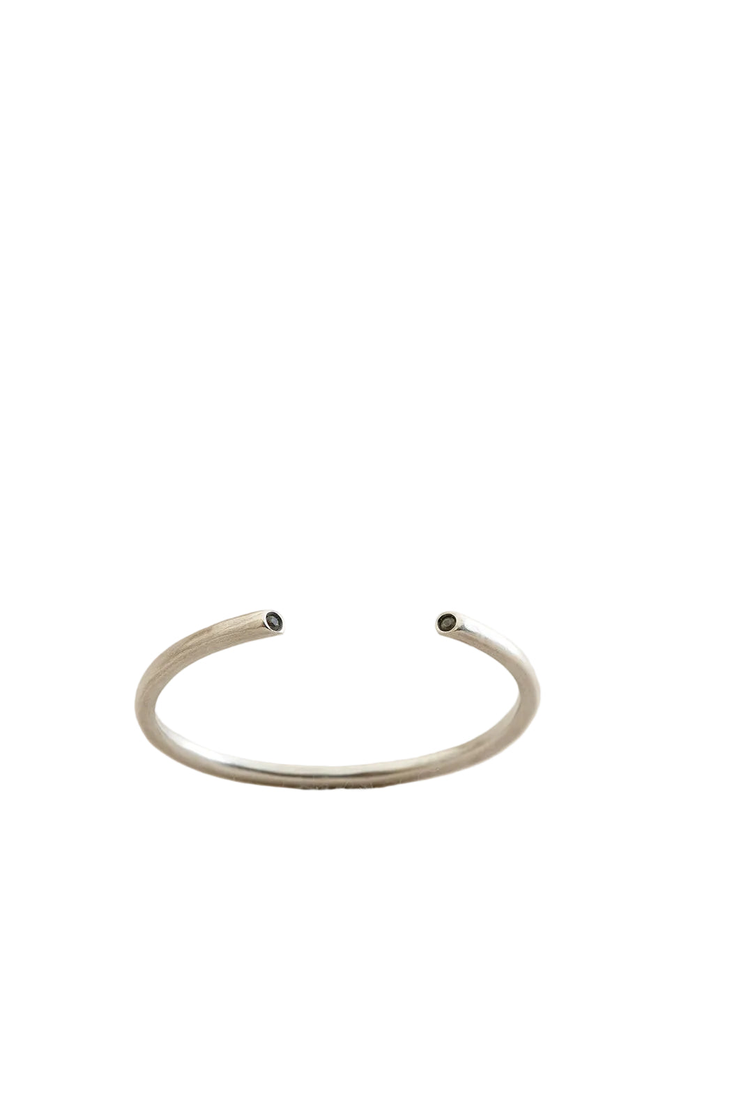 Silver bracelet on a light beige background