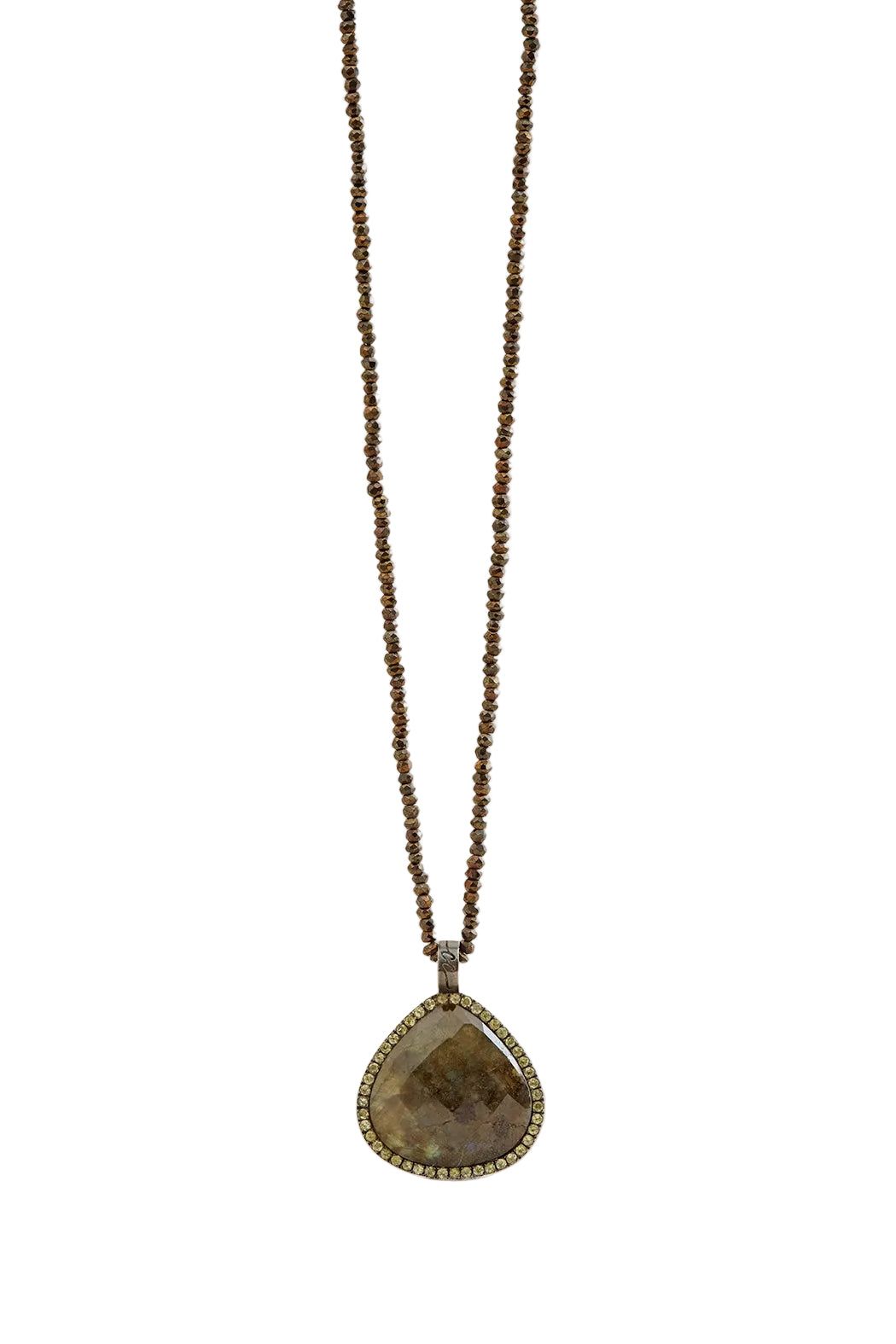 Necklace with a teardrop-shaped pendant on a beige background