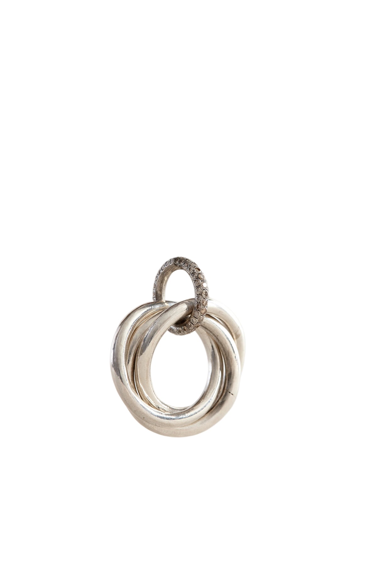 Silver ring pendant on a light gray background