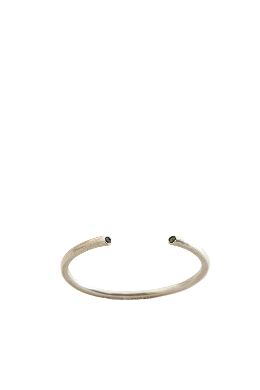 Silver bracelet on a light beige background