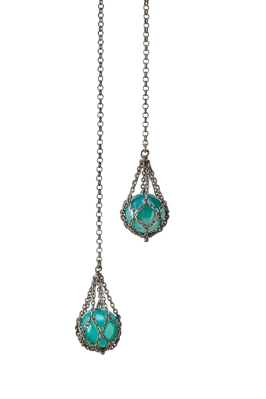 Necklace with turquoise beads and silver chain on a white background