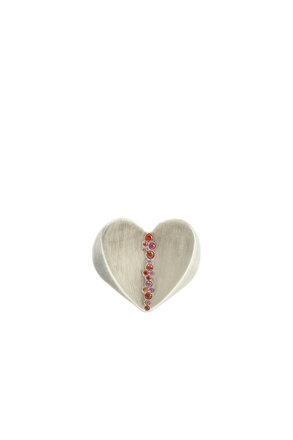 Heart-shaped silver ring with embedded stones on a white background