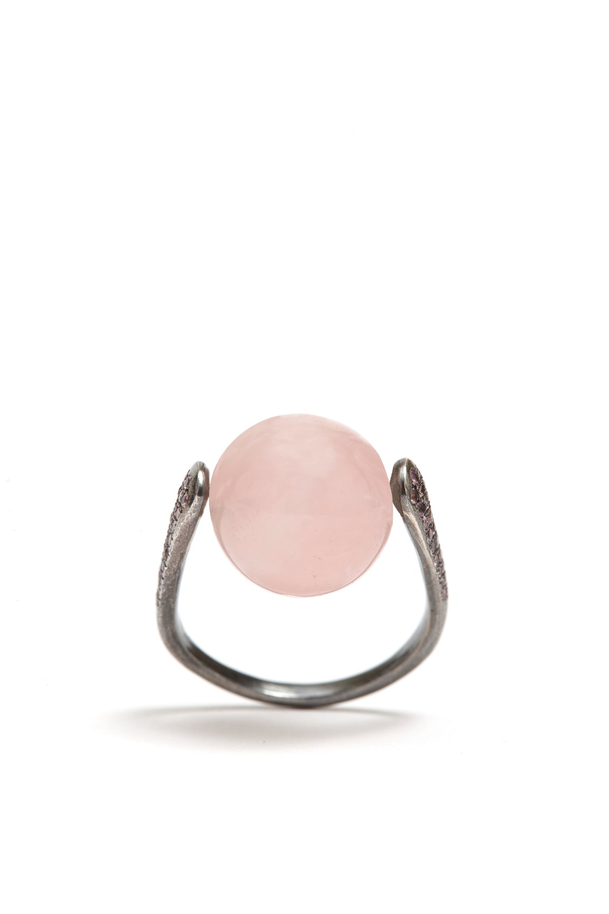 Ring with a pink gemstone on a white background
