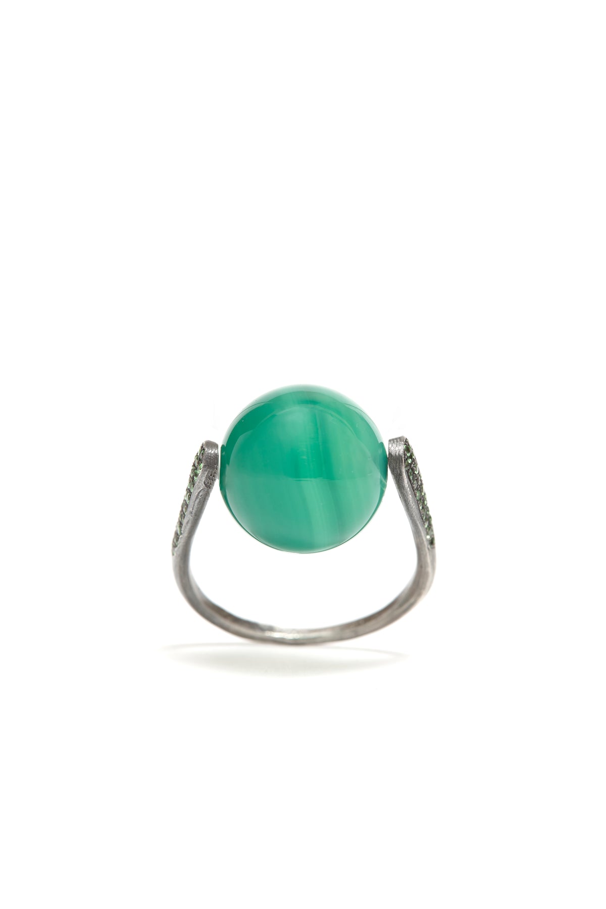 Ring with a green gemstone on a white background