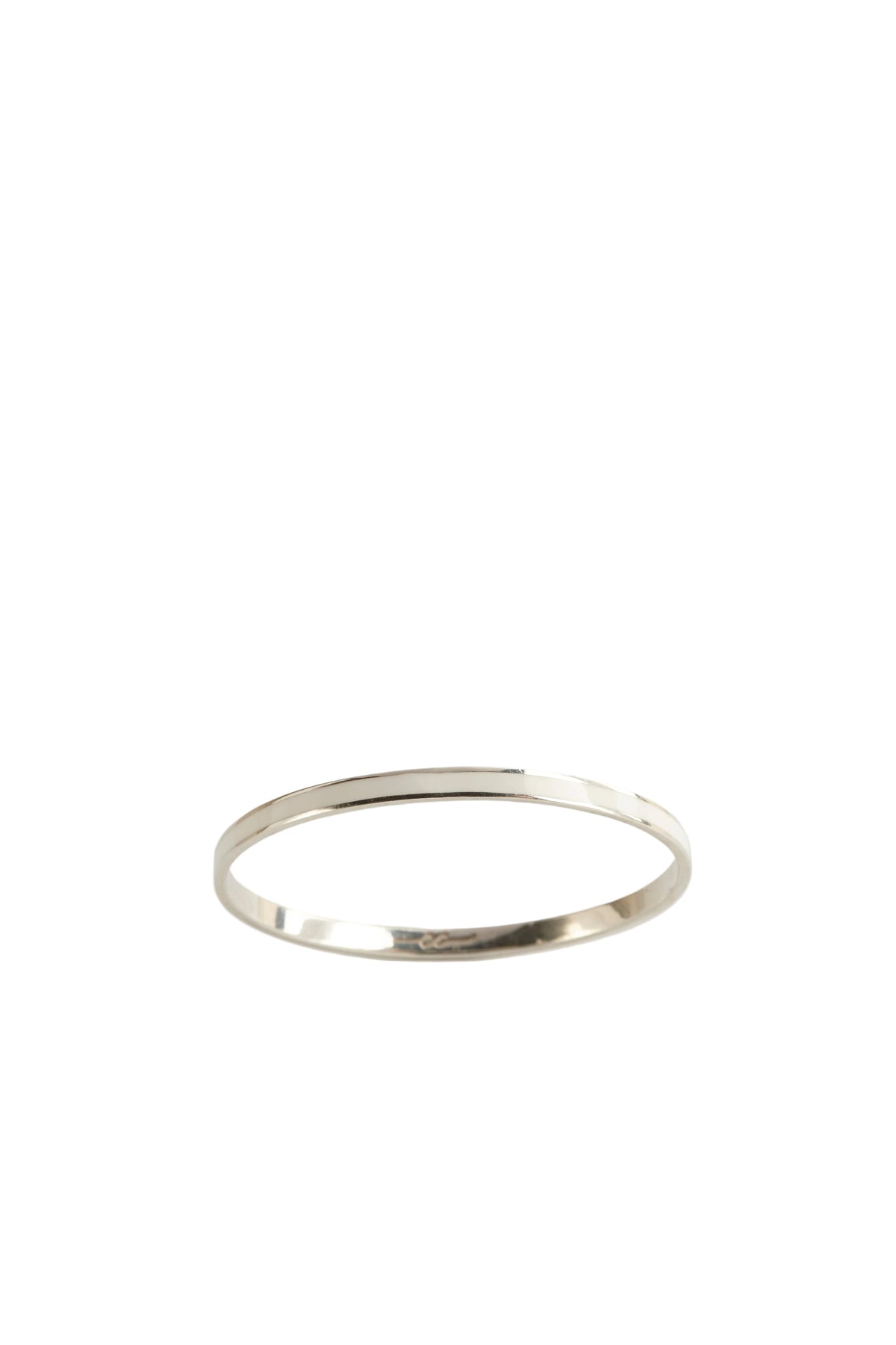 Silver ring on a light gray background
