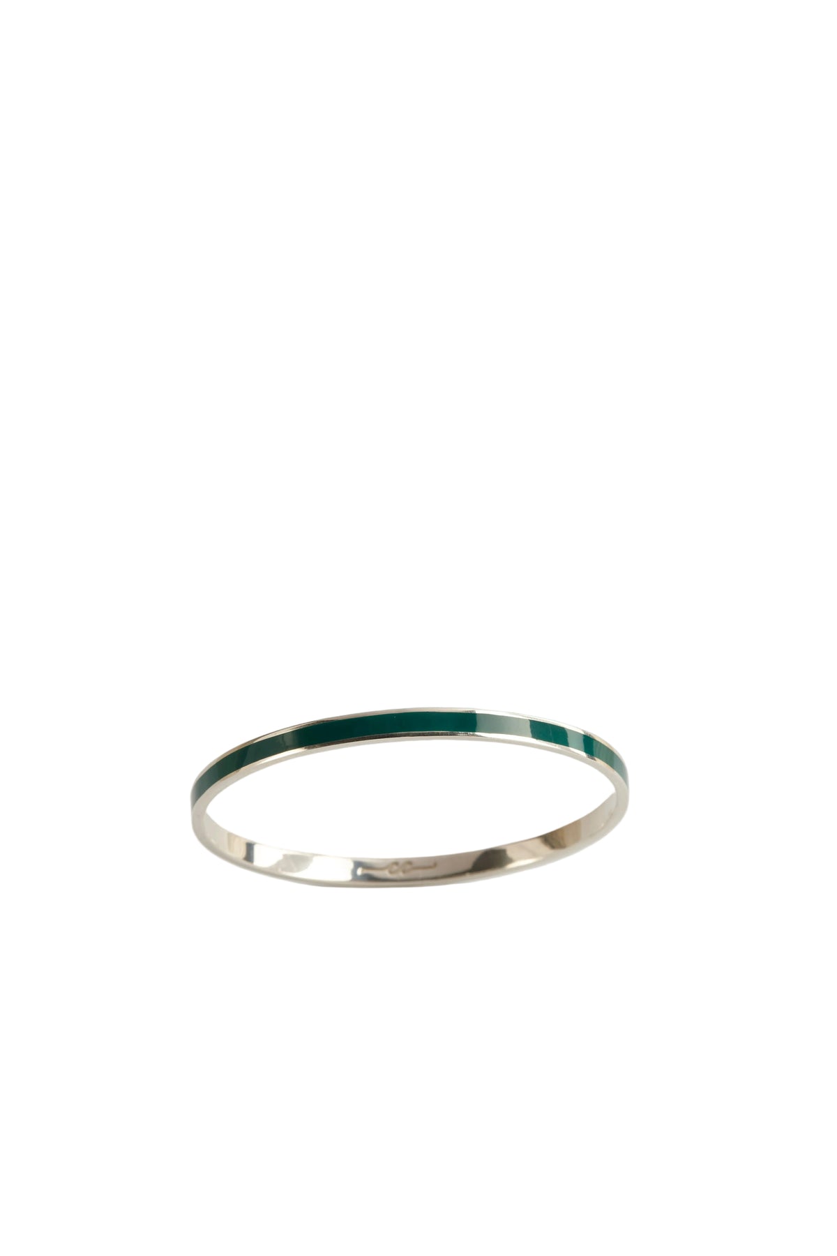 Silver ring with green interior on a light gray background