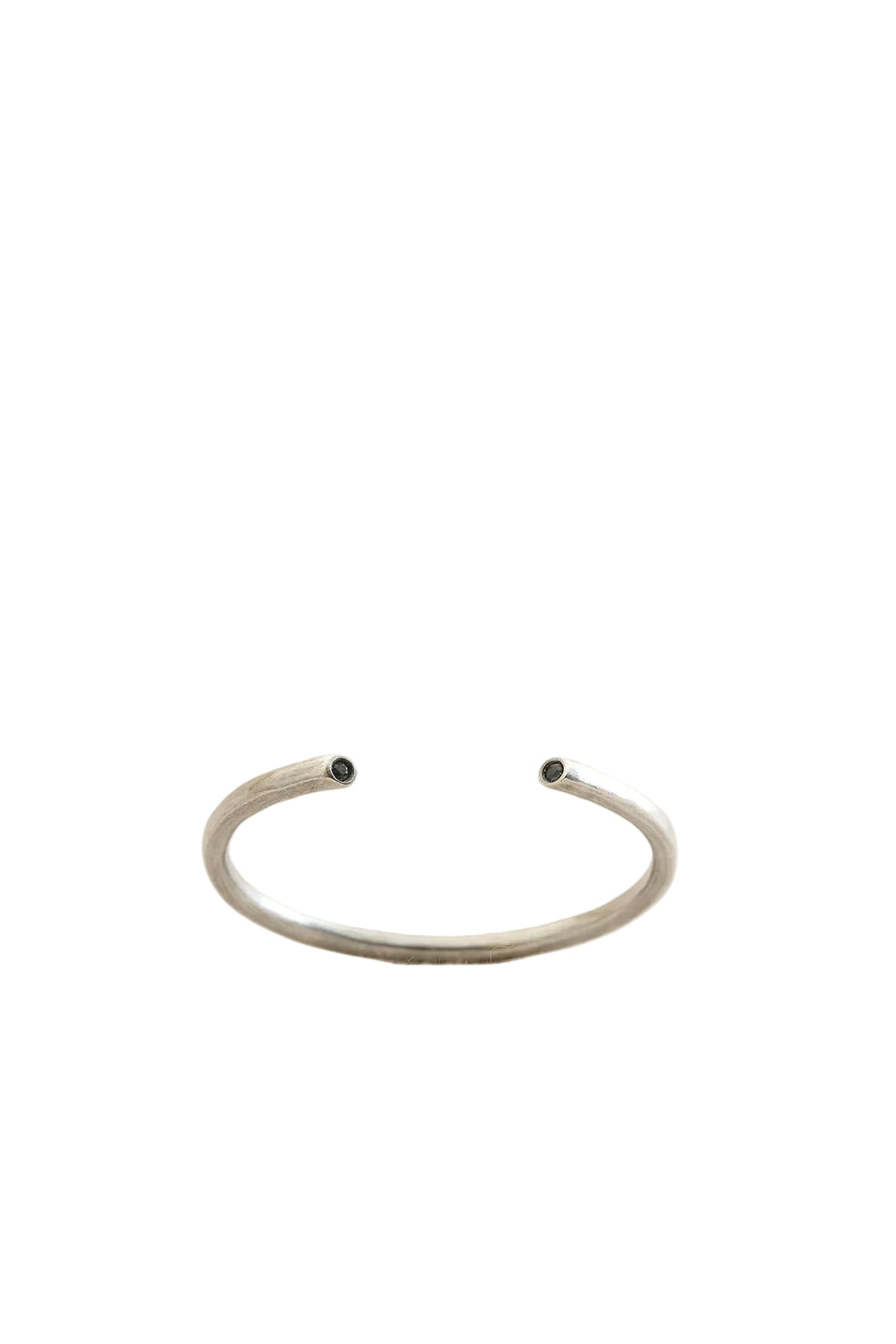 Silver bracelet on a light beige background