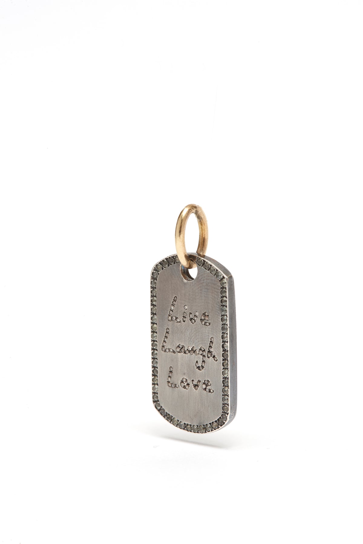 Silver dog tag pendant with engraved text on a white background