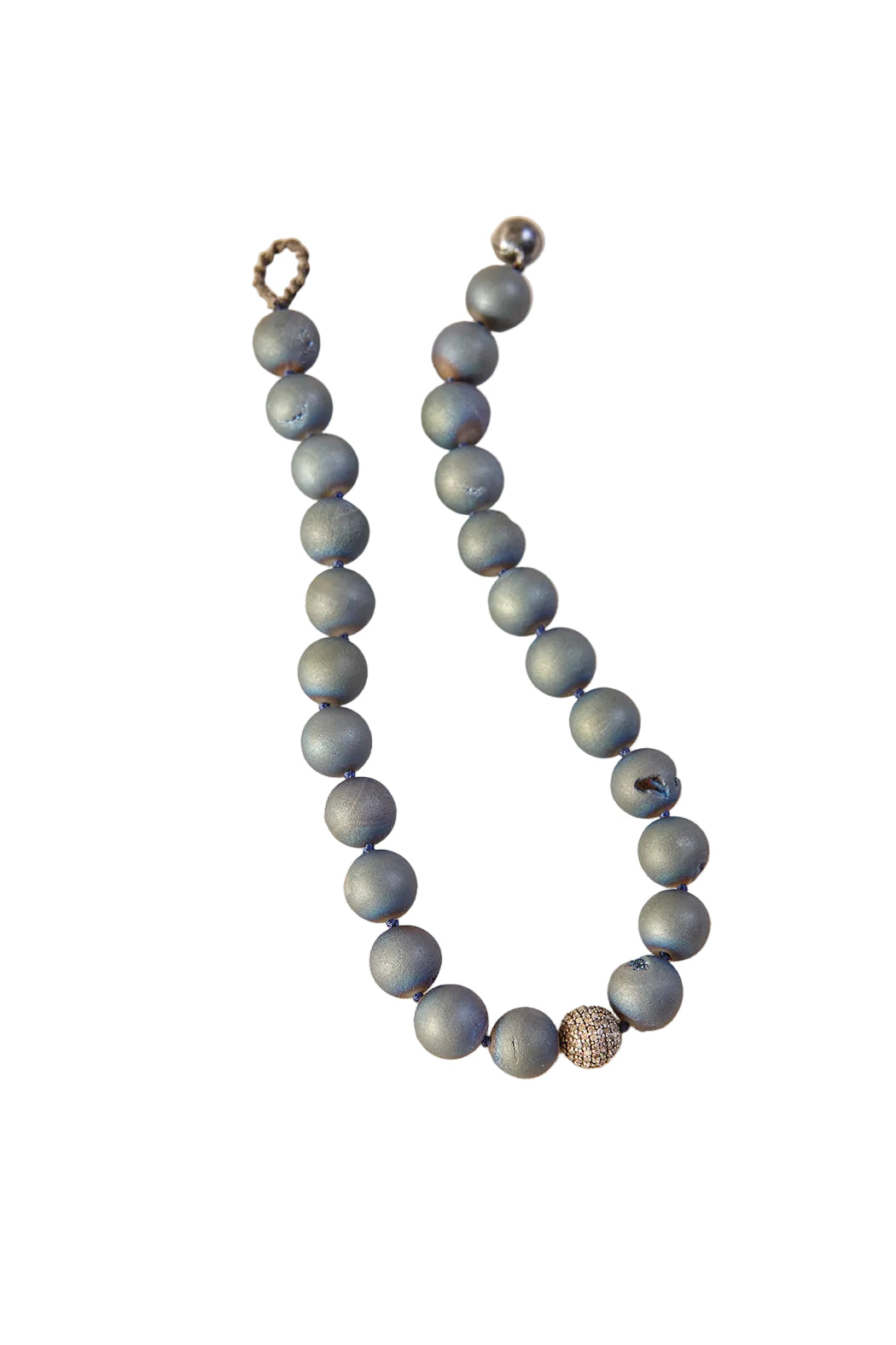 Gray beaded necklace on a light beige background