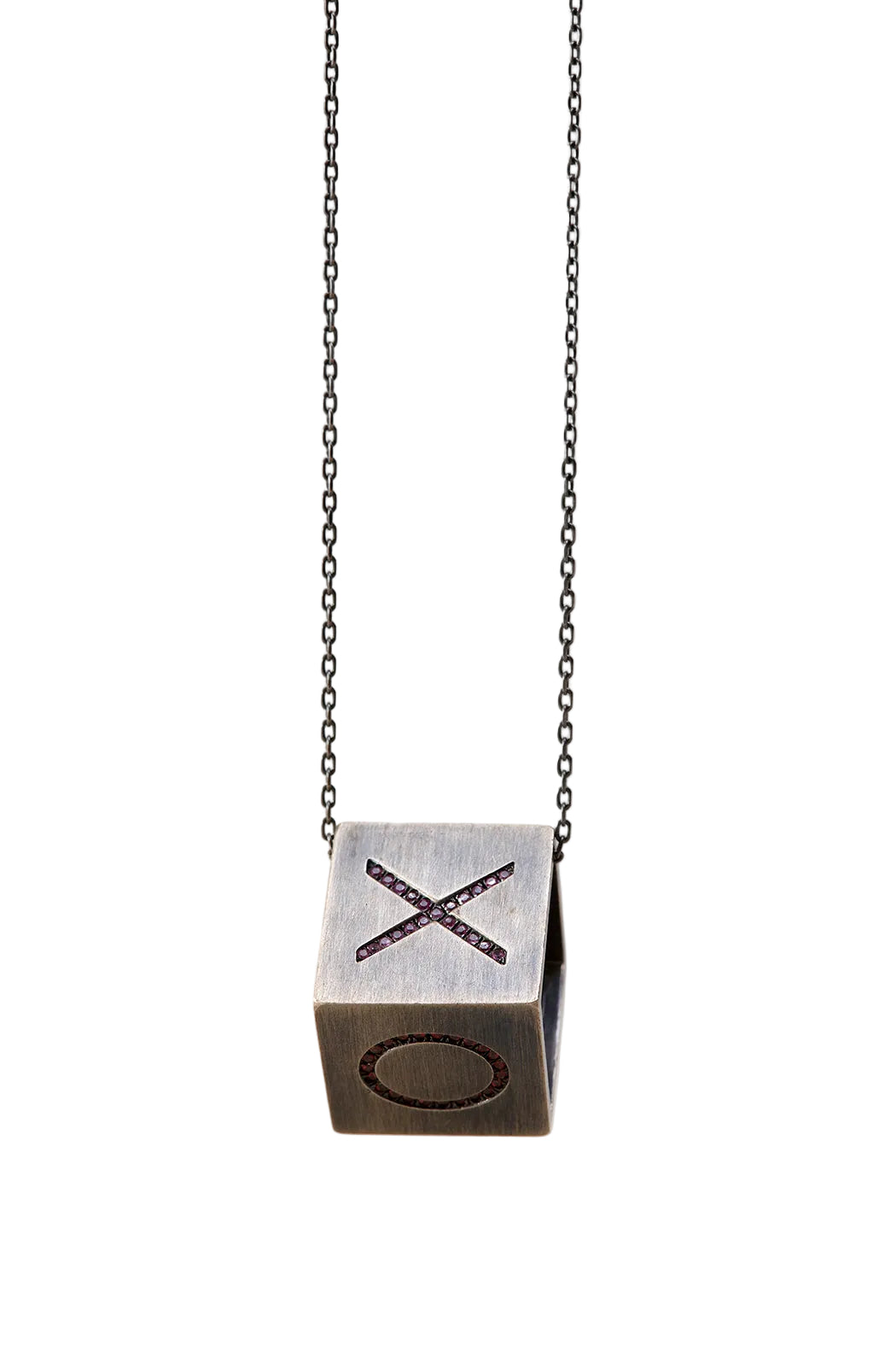 Necklace with a cube pendant featuring 'X' and 'O' symbols on a light gray background