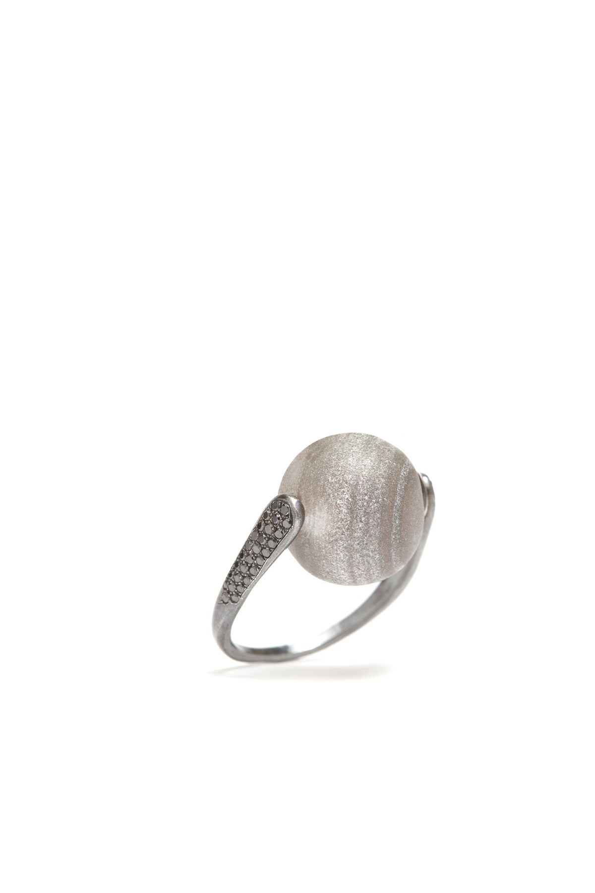 Silver ring with textured design on a white background
