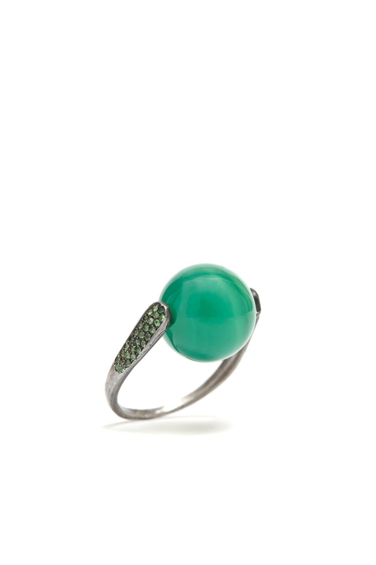 Ring with a green gemstone on a white background