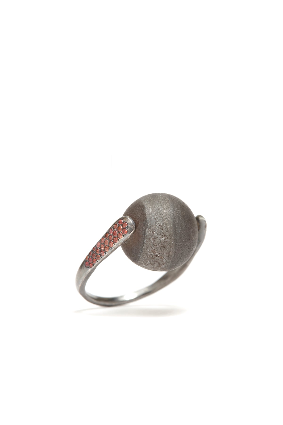 Silver ring with a textured ball design on a white background