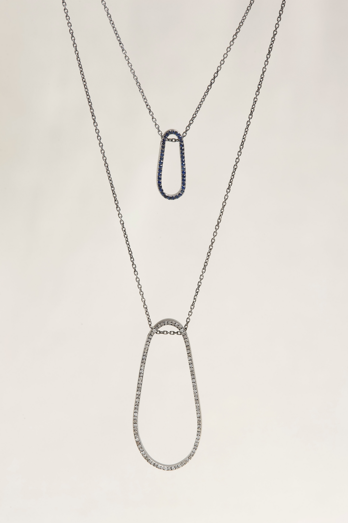 Cynthia Djurovic sterling silver necklaces with royal blue sapphire and clear stone drop pendants on delicate chains